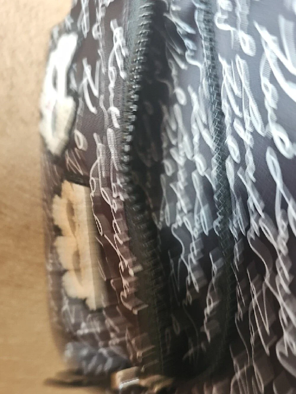 Karl Lagerfeld Black and White Script Mini Backpack with Character Patches